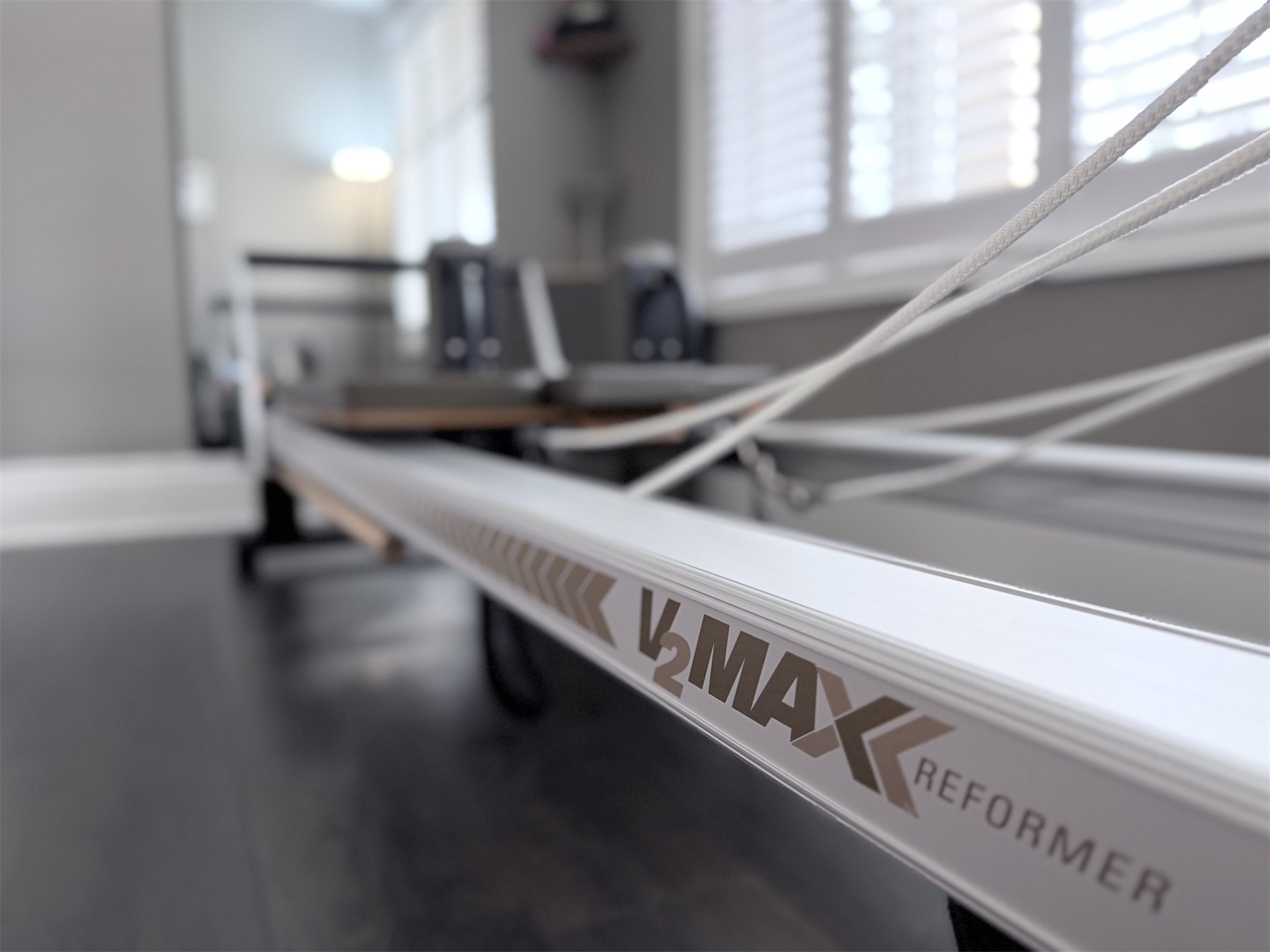 Close view across the Reformer in the home Pilates studio